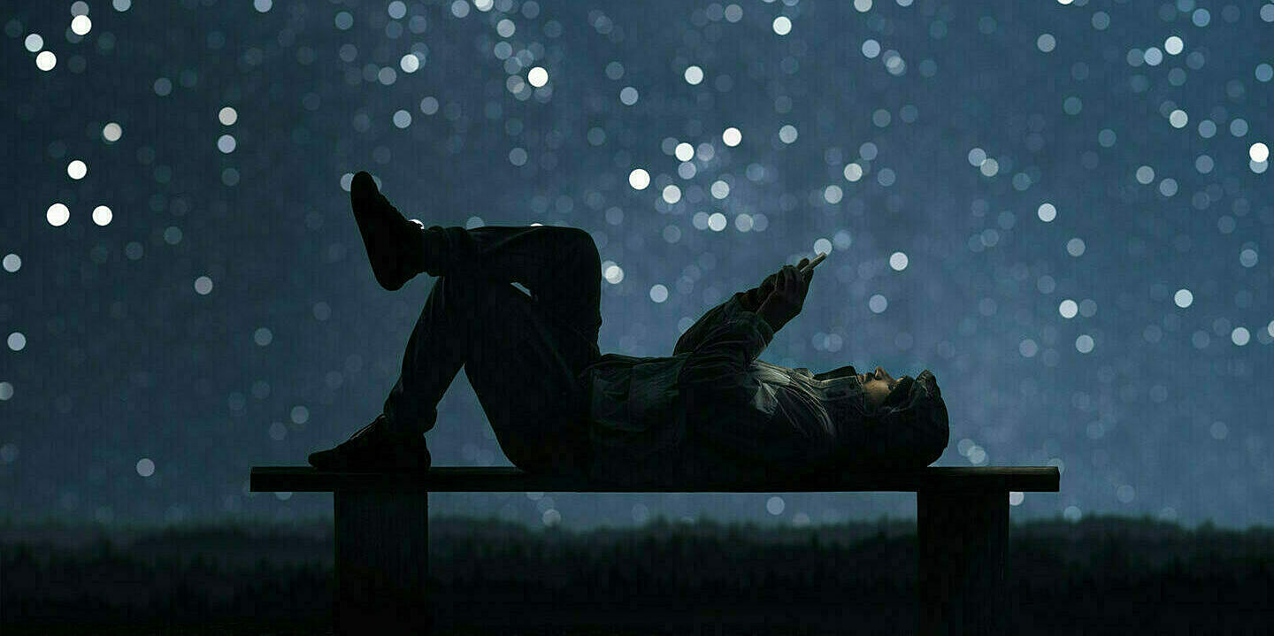 Man-with-phone-under-starlit-sky-2